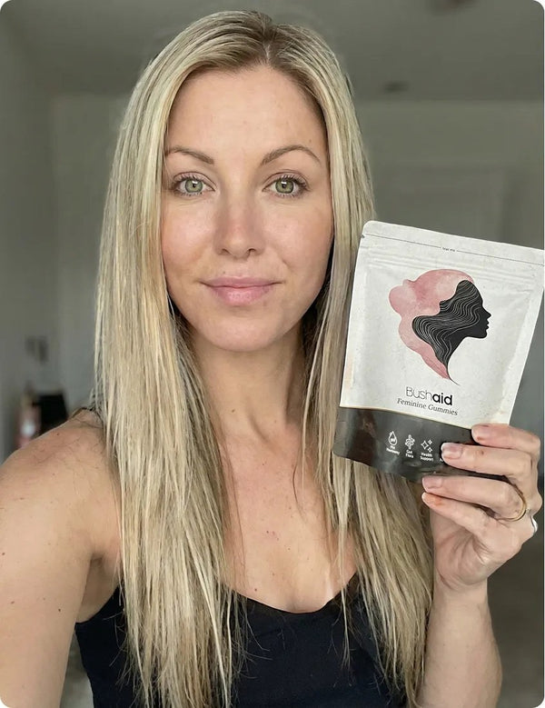 Customer holding Bushaid Feminine Balance Gummies