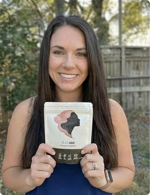 Customer holding Bushaid Feminine Balance Gummies